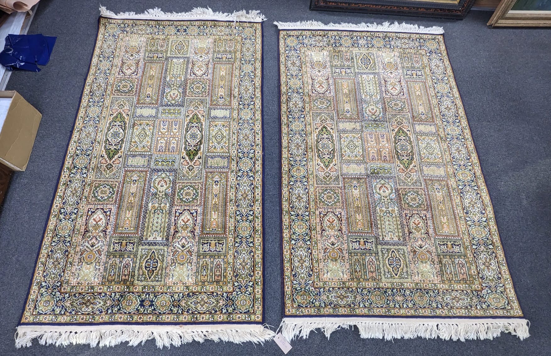 A near pair of North West Persian ivory ground part silk rugs, larger 154 x 95cm